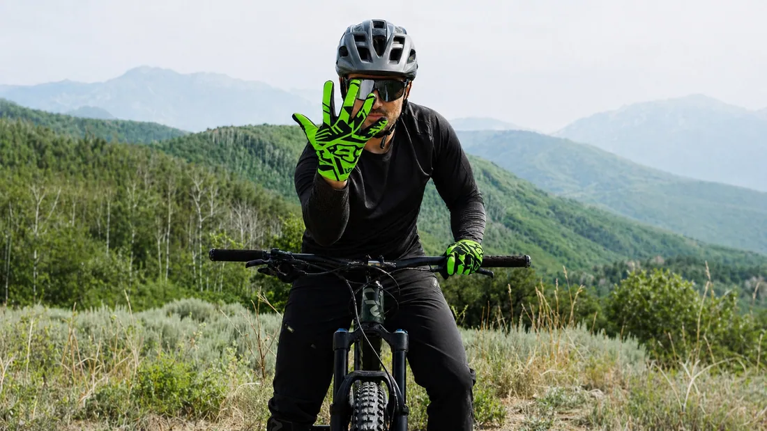 Mountain biker wearing neon Gloves Galore MTB gloves